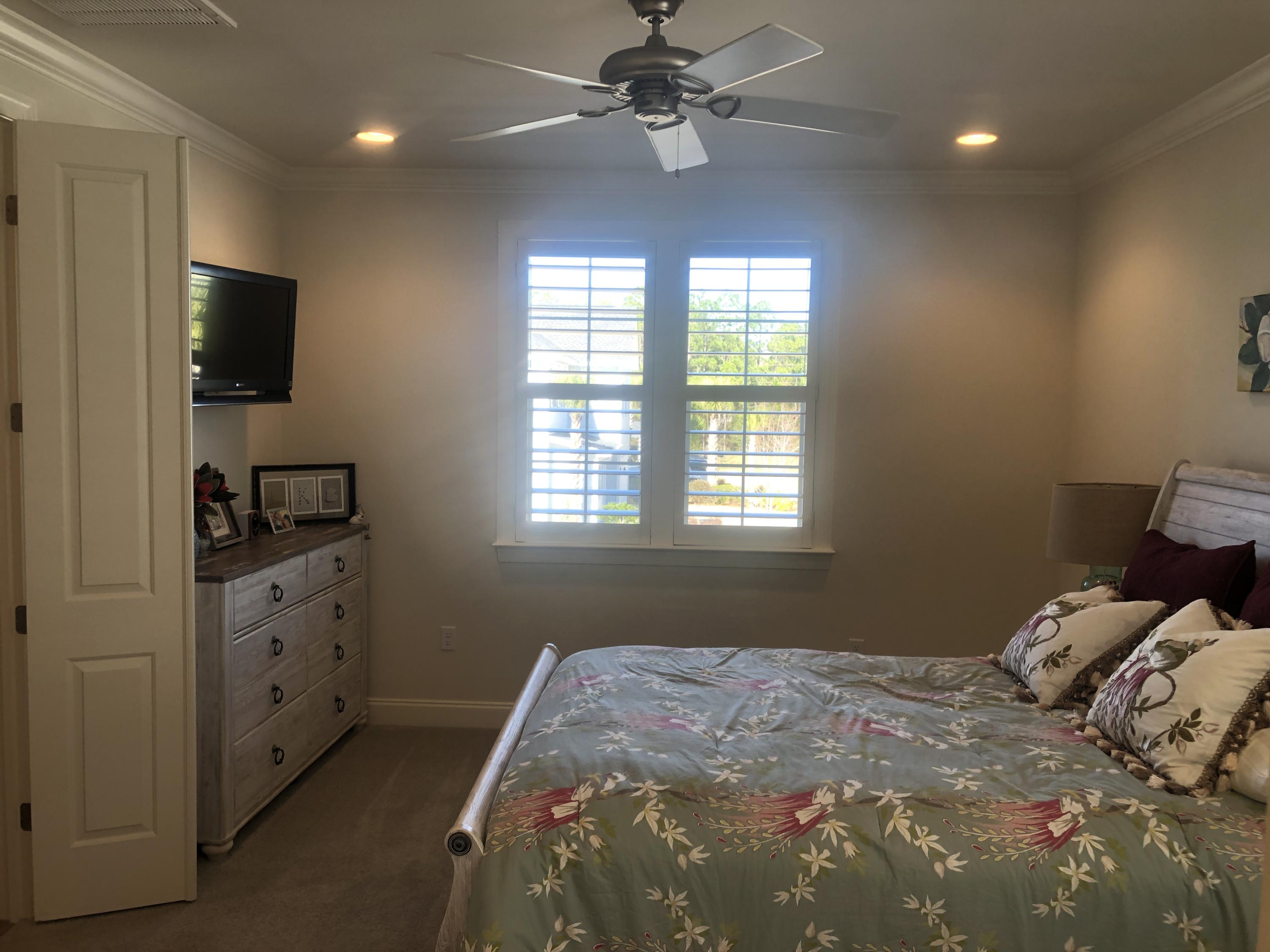 52 Chapman Street Santa Rosa Beach, FL 32459 - Photo 33 of 50 a bedroom with a bed and a flat screen tv