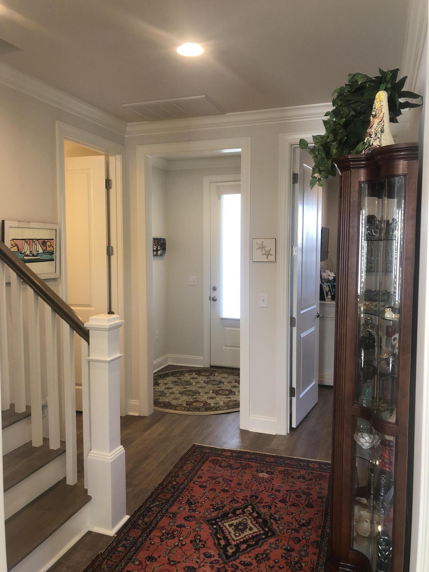 52 Chapman Street Santa Rosa Beach, FL 32459 - Photo 7 of 50 a view of a hallway with wooden floor and a bathroom