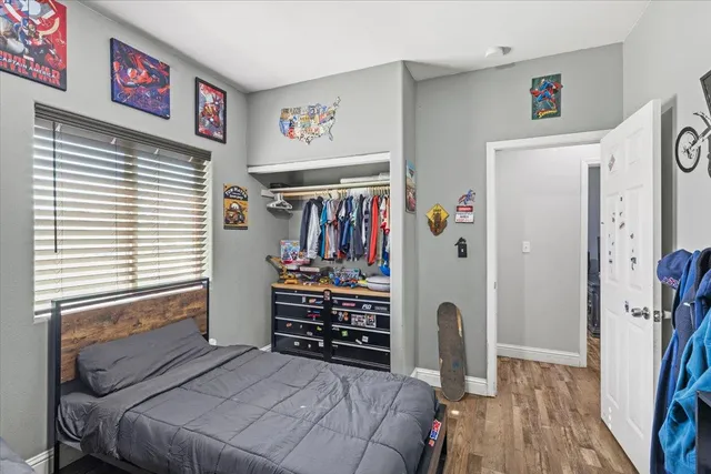 a bedroom with furniture and a window