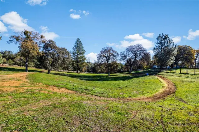 a view of a golf course with a lake view