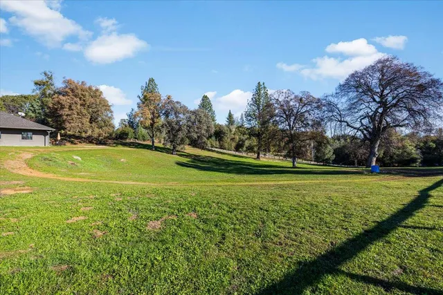 a view of a golf course with a lake