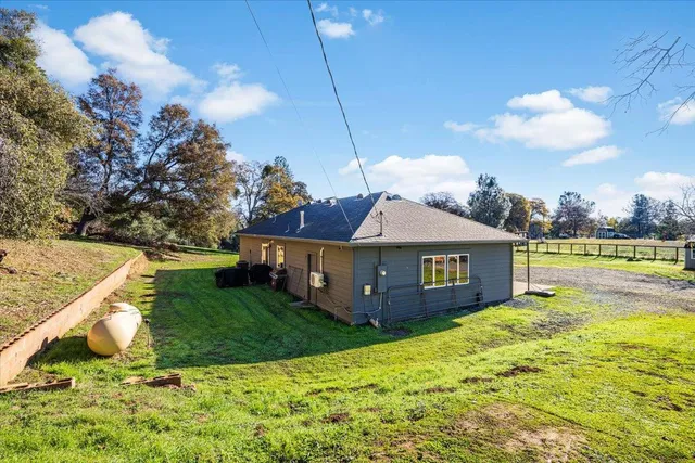 a view of a house with a big yard