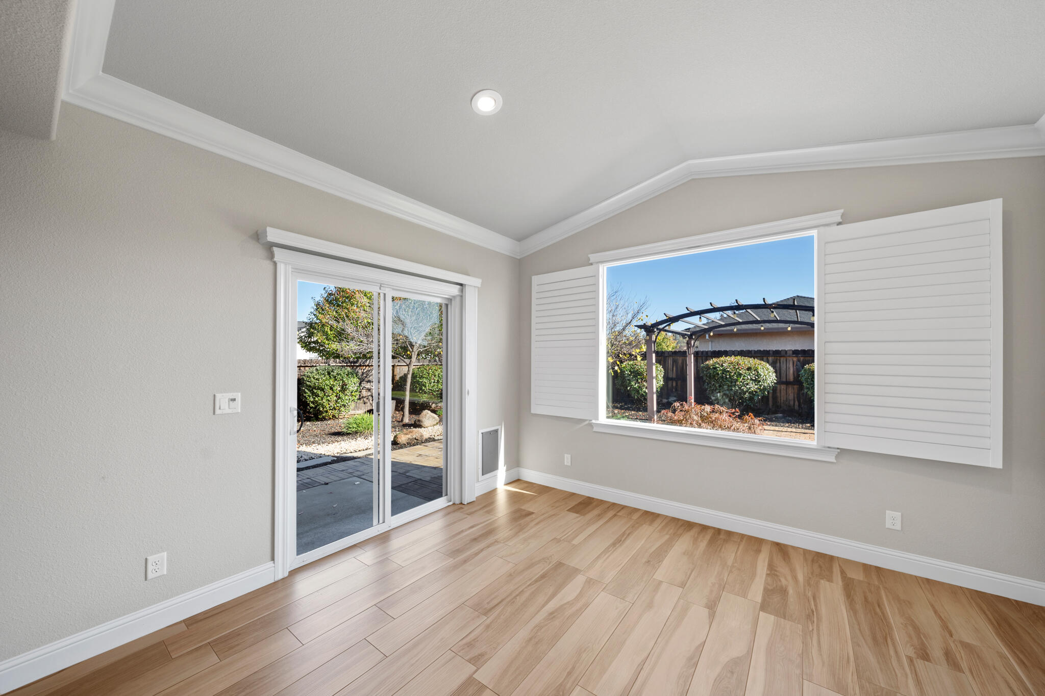 3375 Karuk Avenue Redding, CA 96002 - Photo 14 of 41 a view of an empty room with a window and wooden floor