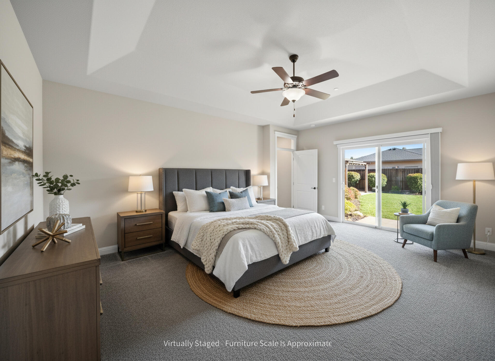 3375 Karuk Avenue Redding, CA 96002 - Photo 15 of 41 a spacious bedroom with a bed a couch and a chandelier