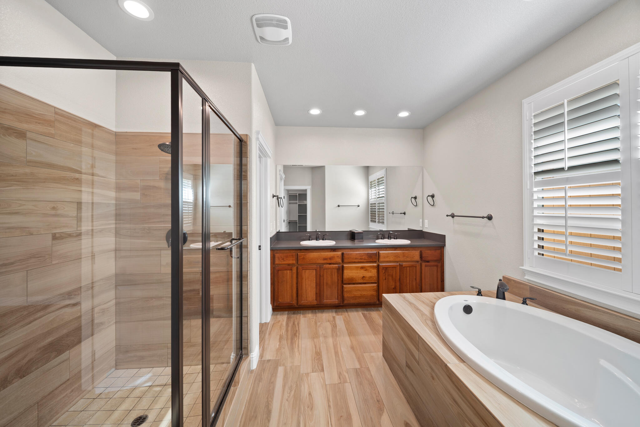 3375 Karuk Avenue Redding, CA 96002 - Photo 17 of 41 a large bathroom with a tub sink shower and mirror