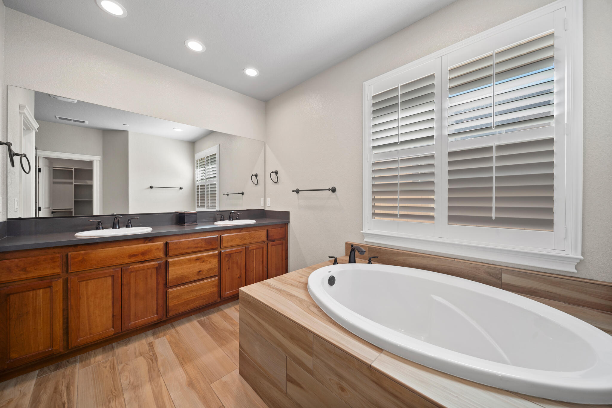 3375 Karuk Avenue Redding, CA 96002 - Photo 20 of 41 a bathroom with a granite countertop tub sink and mirror