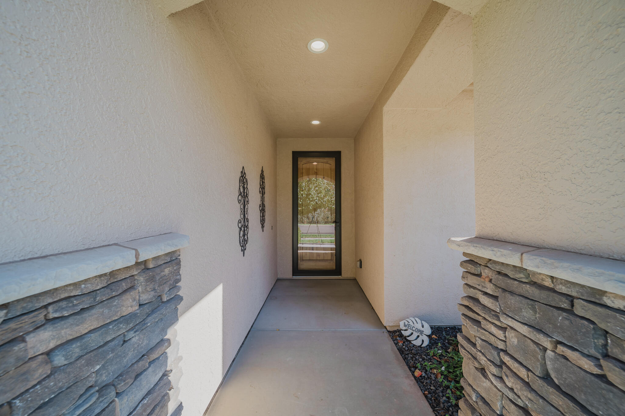 3375 Karuk Avenue Redding, CA 96002 - Photo 2 of 41 a view of a hallway with wooden floor and stairs