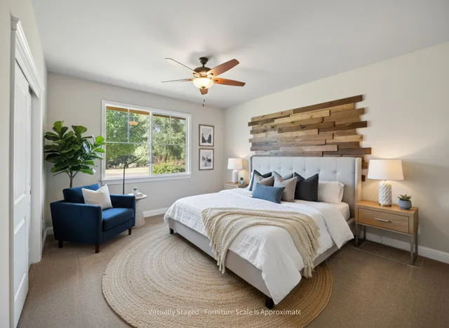 a bedroom with a large bed and a couch