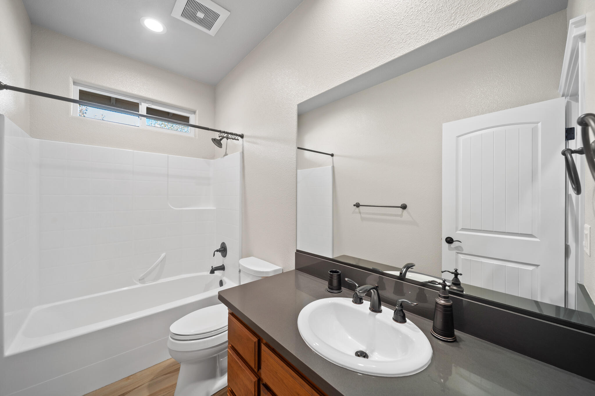 3375 Karuk Avenue Redding, CA 96002 - Photo 28 of 41 a bathroom with a sink toilet a mirror and shower