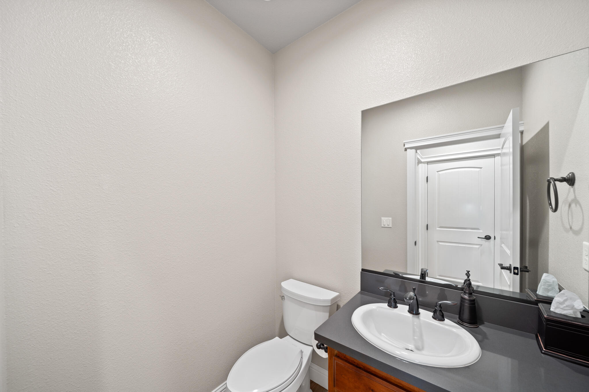3375 Karuk Avenue Redding, CA 96002 - Photo 29 of 41 a bathroom with a toilet a sink and mirror