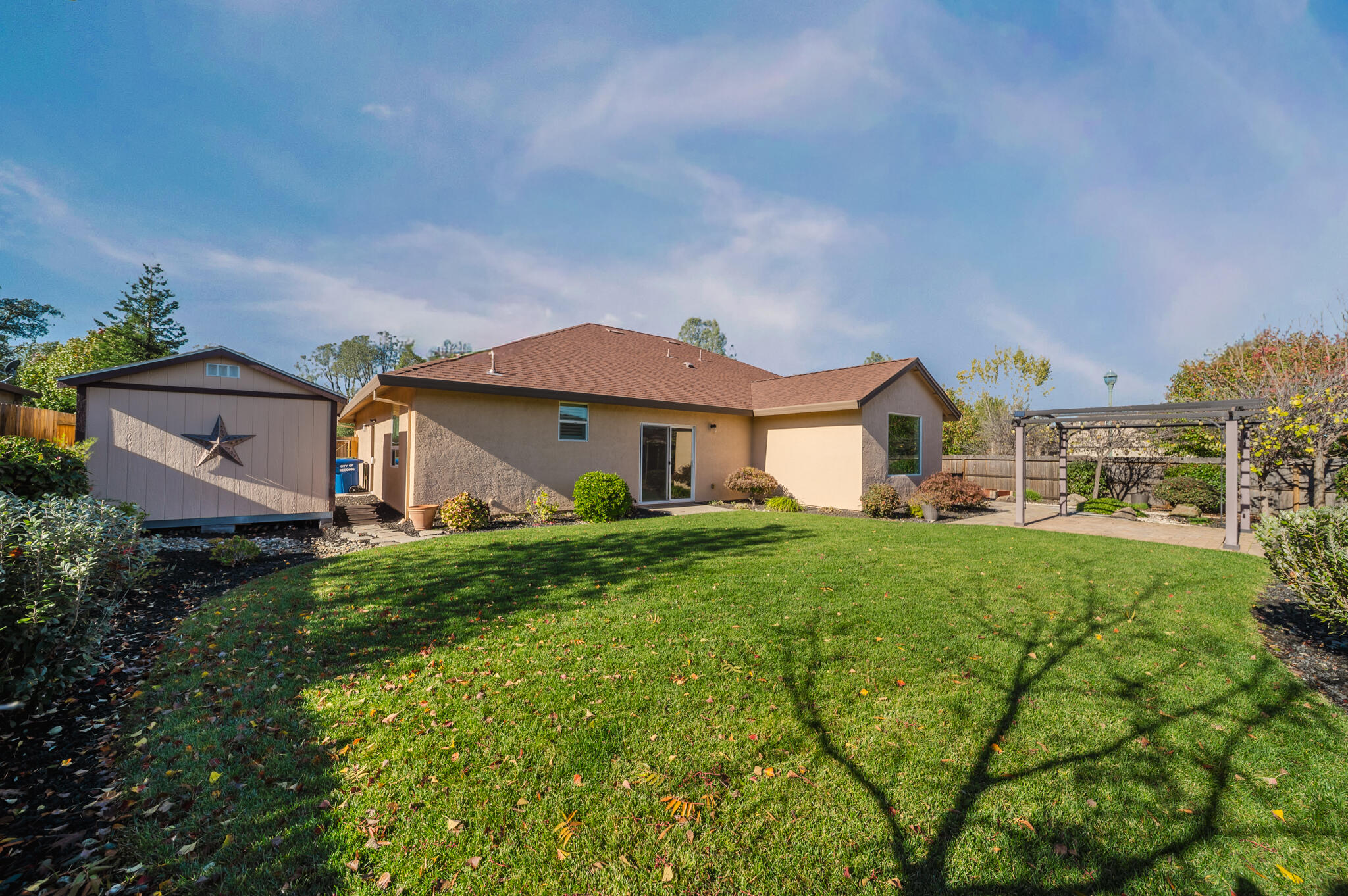 3375 Karuk Avenue Redding, CA 96002 - Photo 31 of 41 a front view of a house with yard and green space