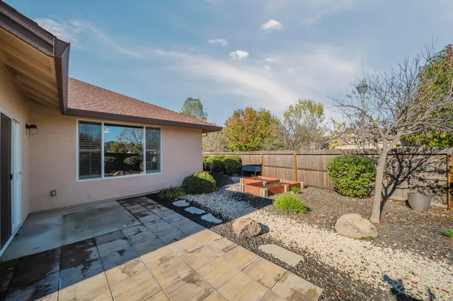 a view of a backyard with potted plants