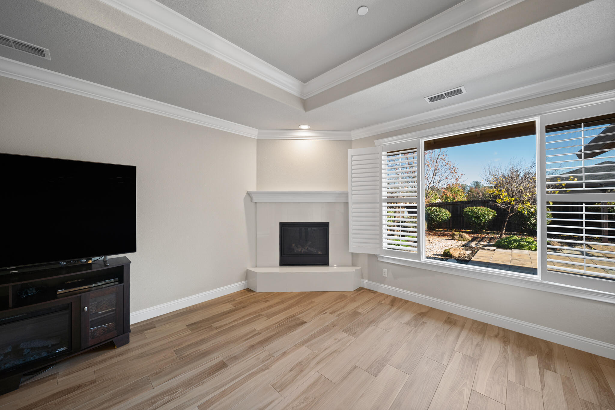 3375 Karuk Avenue Redding, CA 96002 - Photo 6 of 41 a view of a room with wooden floor and fireplace