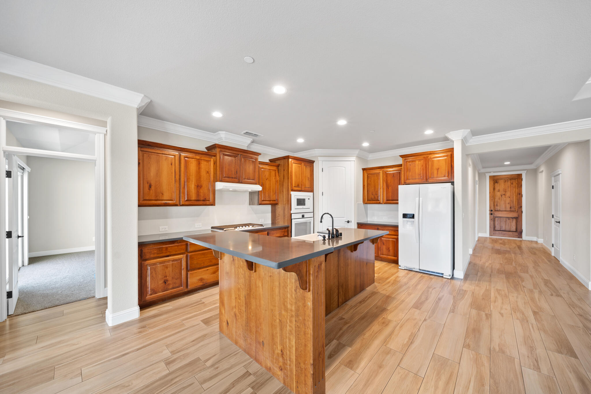 3375 Karuk Avenue Redding, CA 96002 - Photo 7 of 41 a kitchen with stainless steel appliances granite countertop a stove and a refrigerator
