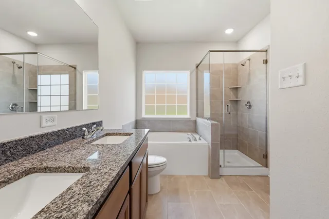 a view of walk in closet with wooden floor