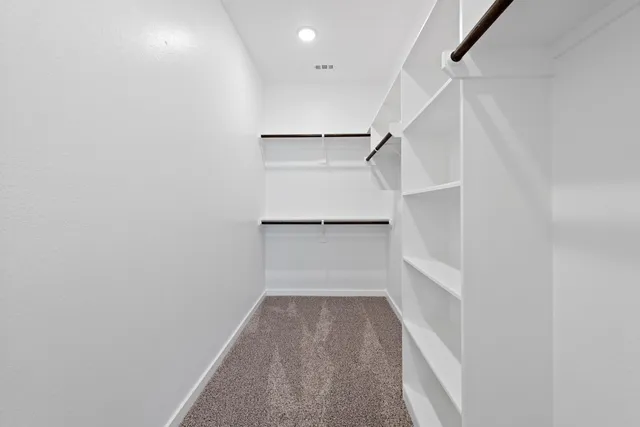 a view of a house with backyard and garden