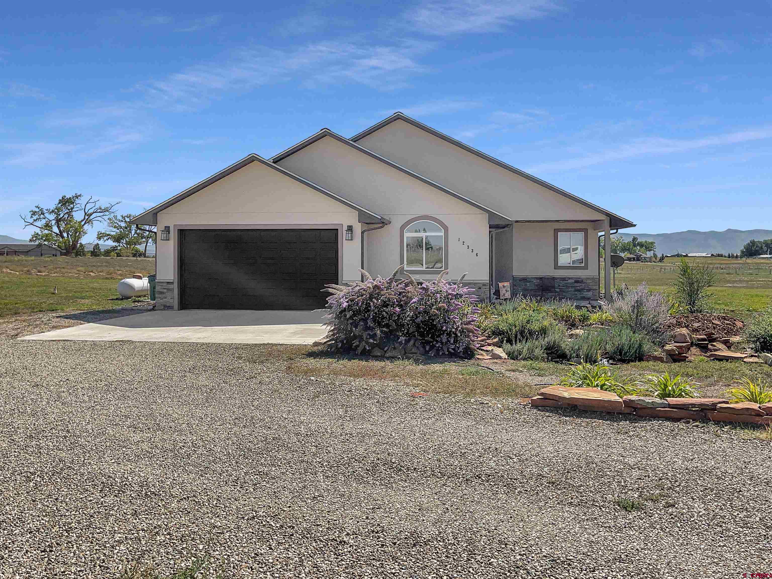 12336 Road 23.25 Loop Cortez, CO 81321 - Photo 2 of 34 a house with a outdoor space