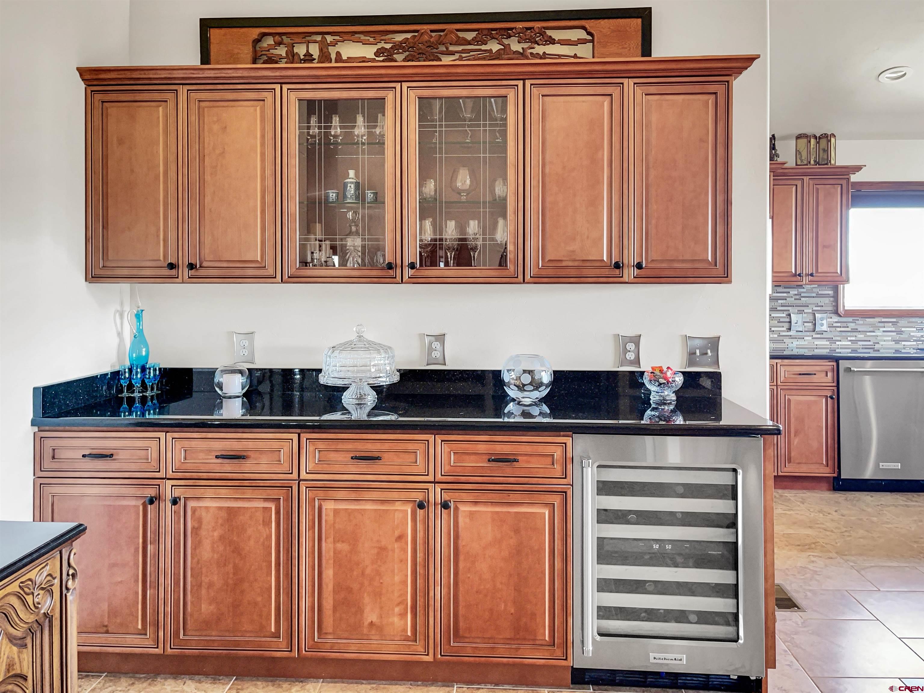 12336 Road 23.25 Loop Cortez, CO 81321 - Photo 17 of 34 a kitchen with granite countertop a sink and cabinets