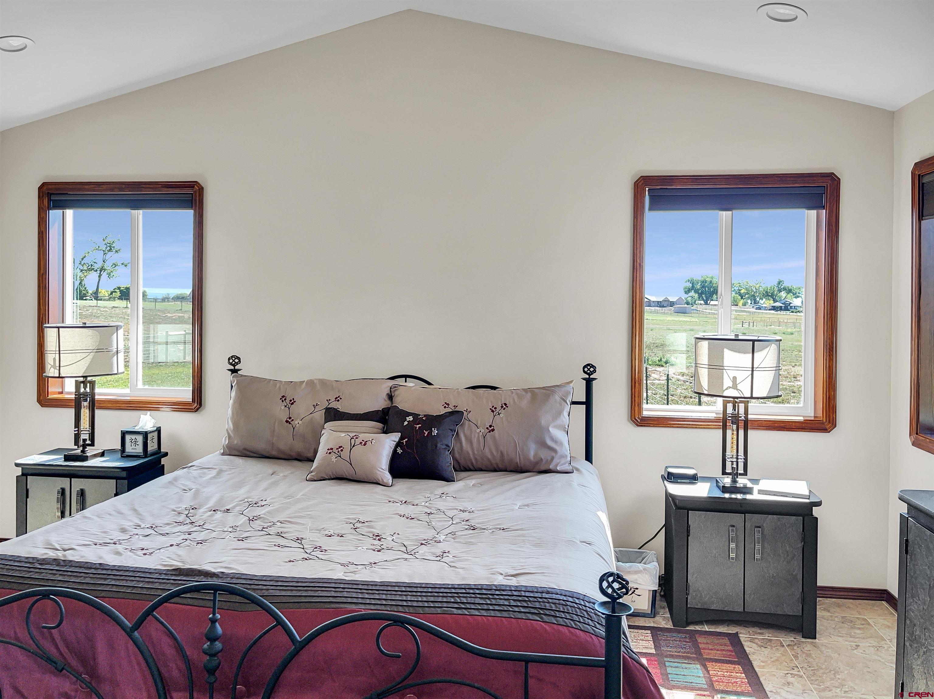 12336 Road 23.25 Loop Cortez, CO 81321 - Photo 20 of 34 a bedroom with bed and window