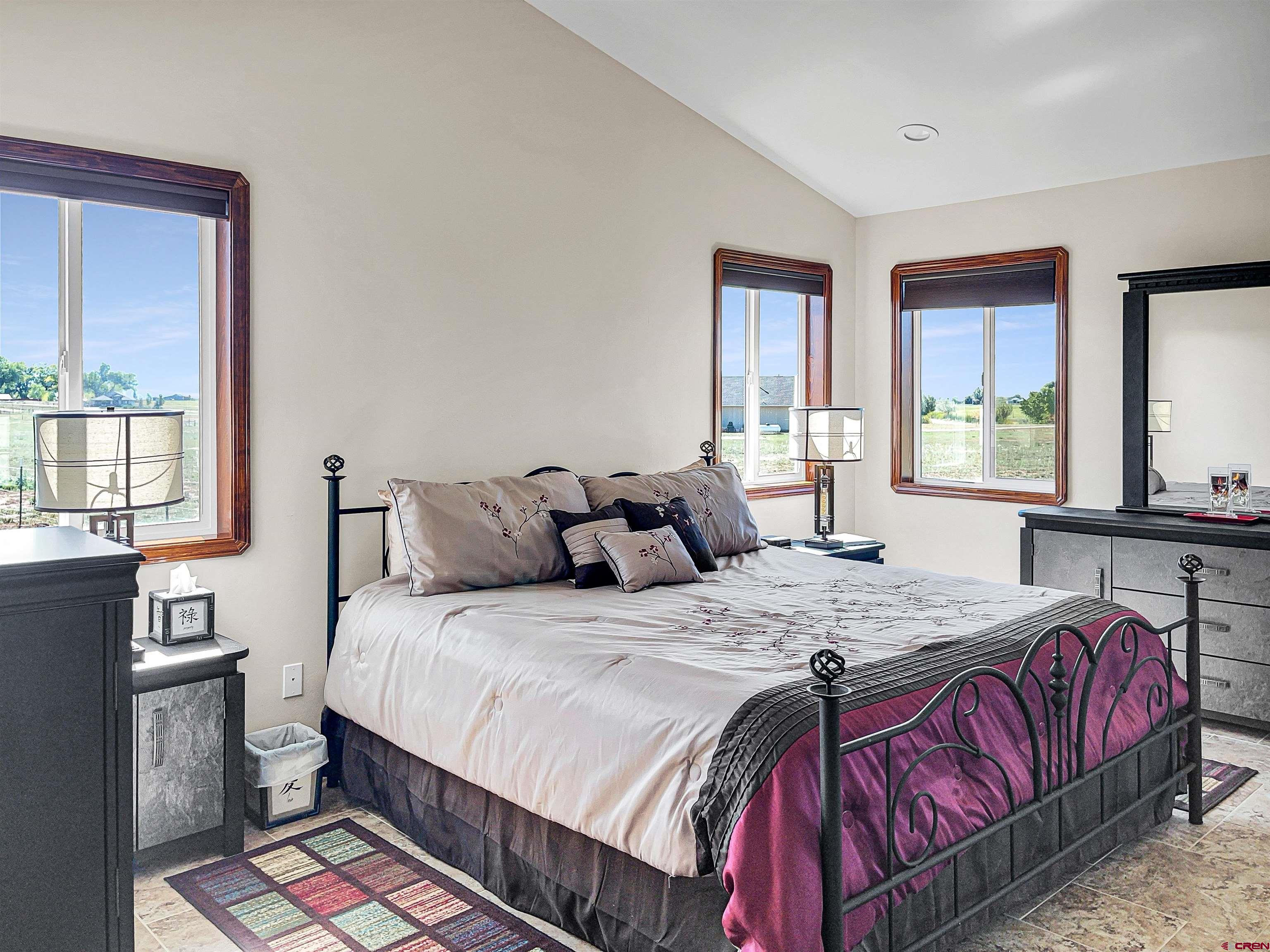 12336 Road 23.25 Loop Cortez, CO 81321 - Photo 21 of 34 a bedroom with a bed and window