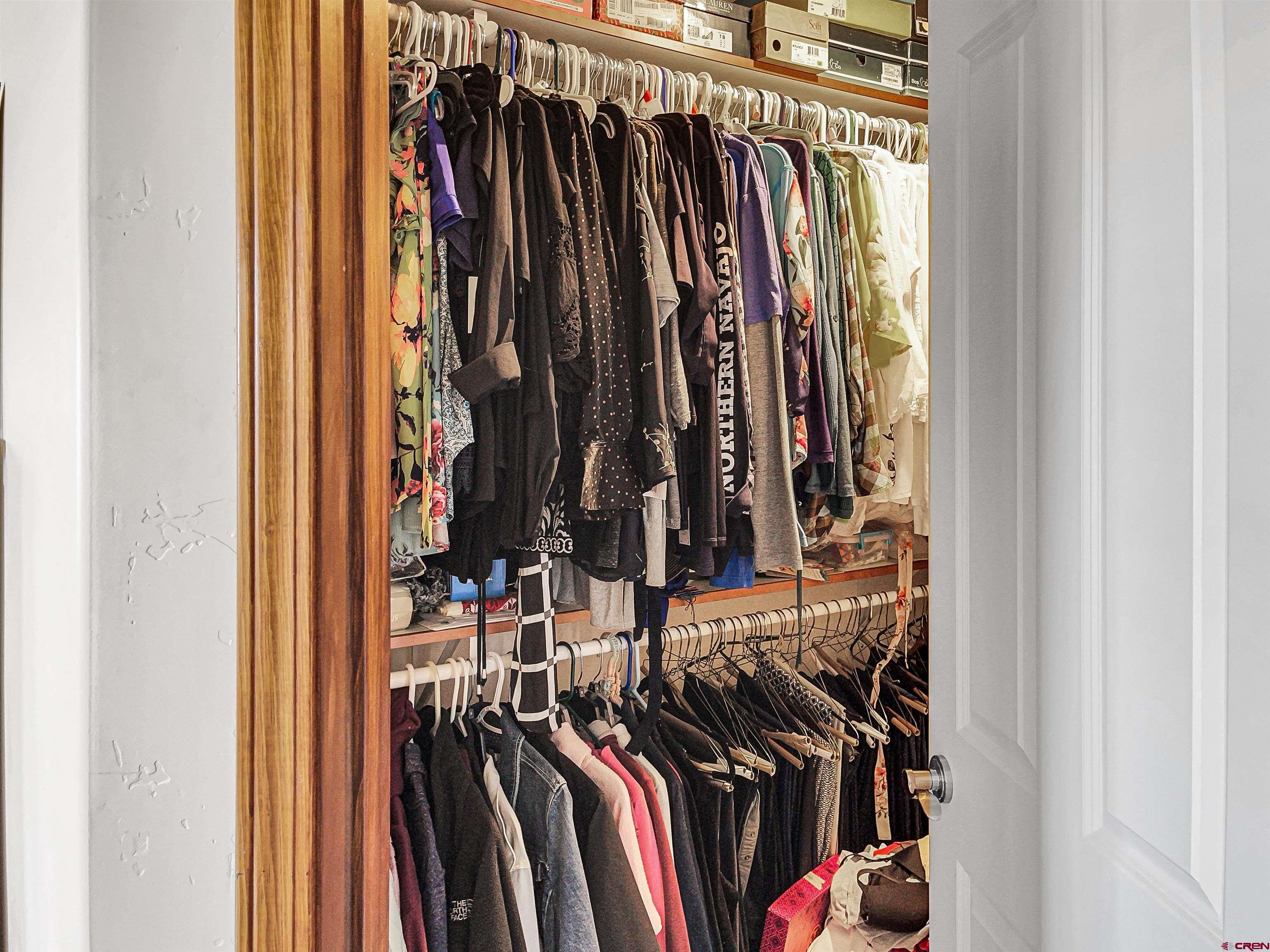 12336 Road 23.25 Loop Cortez, CO 81321 - Photo 22 of 34 a view of walk in closet with clothes