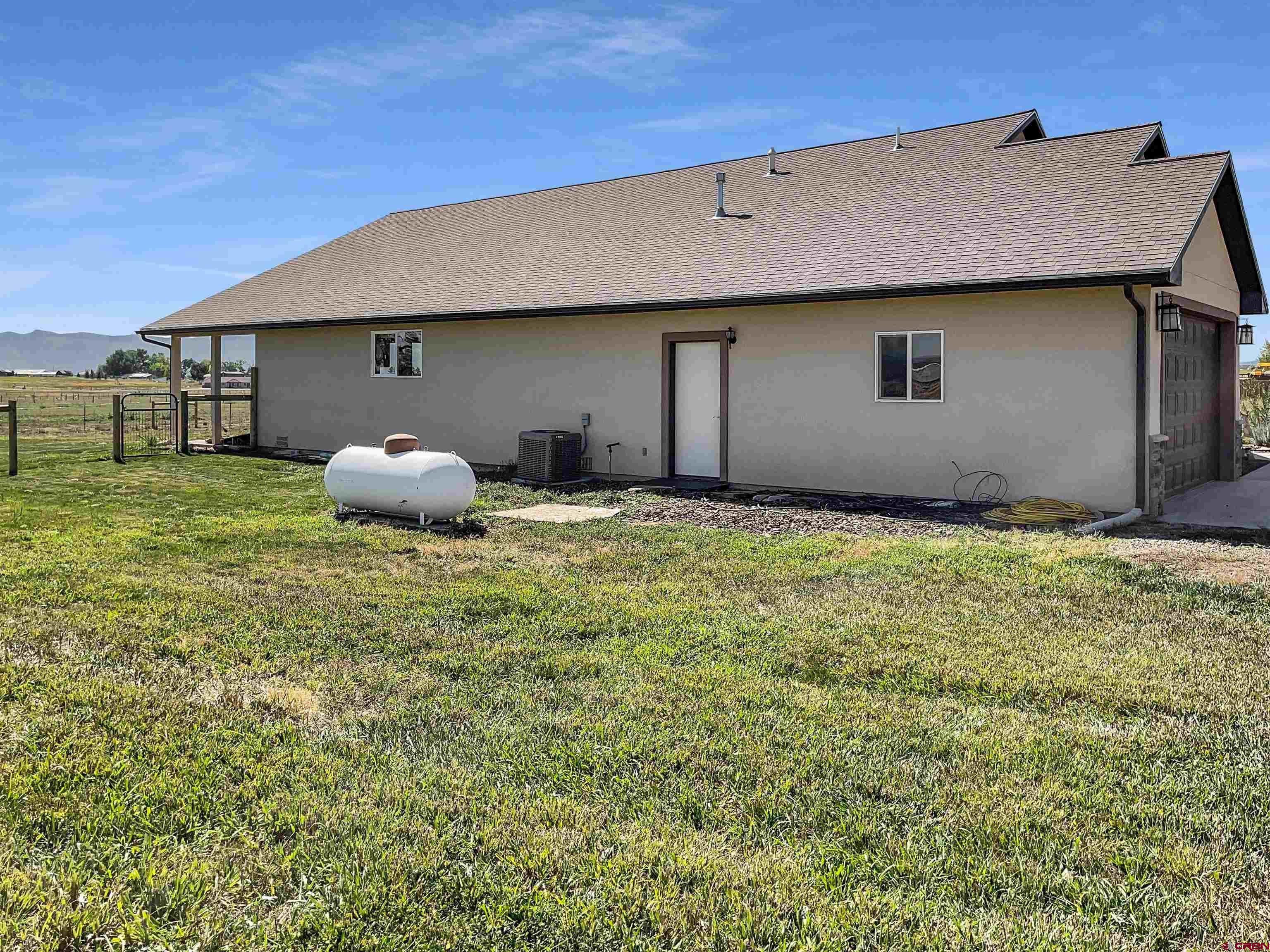 12336 Road 23.25 Loop Cortez, CO 81321 - Photo 28 of 34 a house view with a garden space