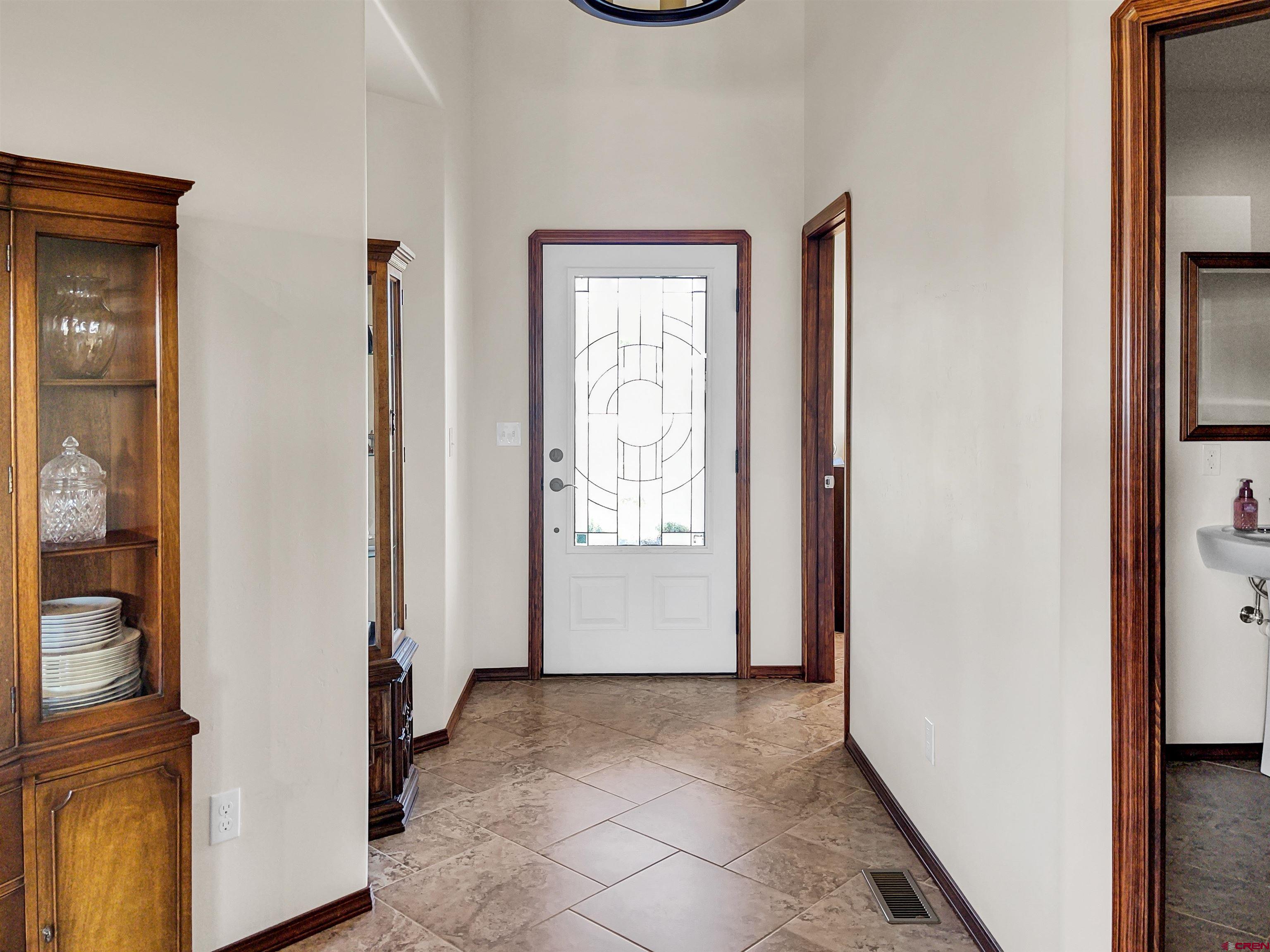 12336 Road 23.25 Loop Cortez, CO 81321 - Photo 5 of 34 a view of a hallway with front door