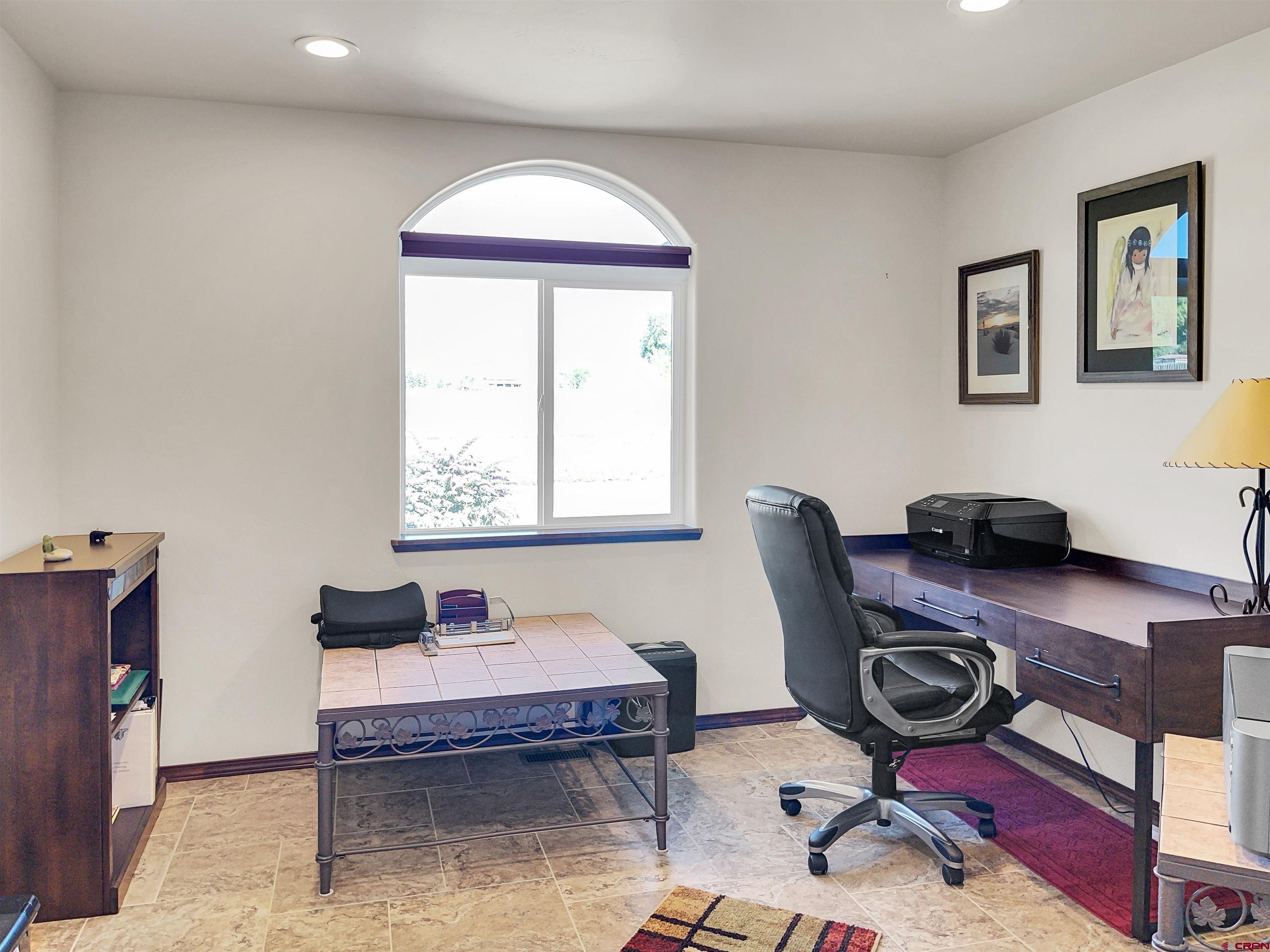 12336 Road 23.25 Loop Cortez, CO 81321 - Photo 6 of 34 a workspace with furniture and window