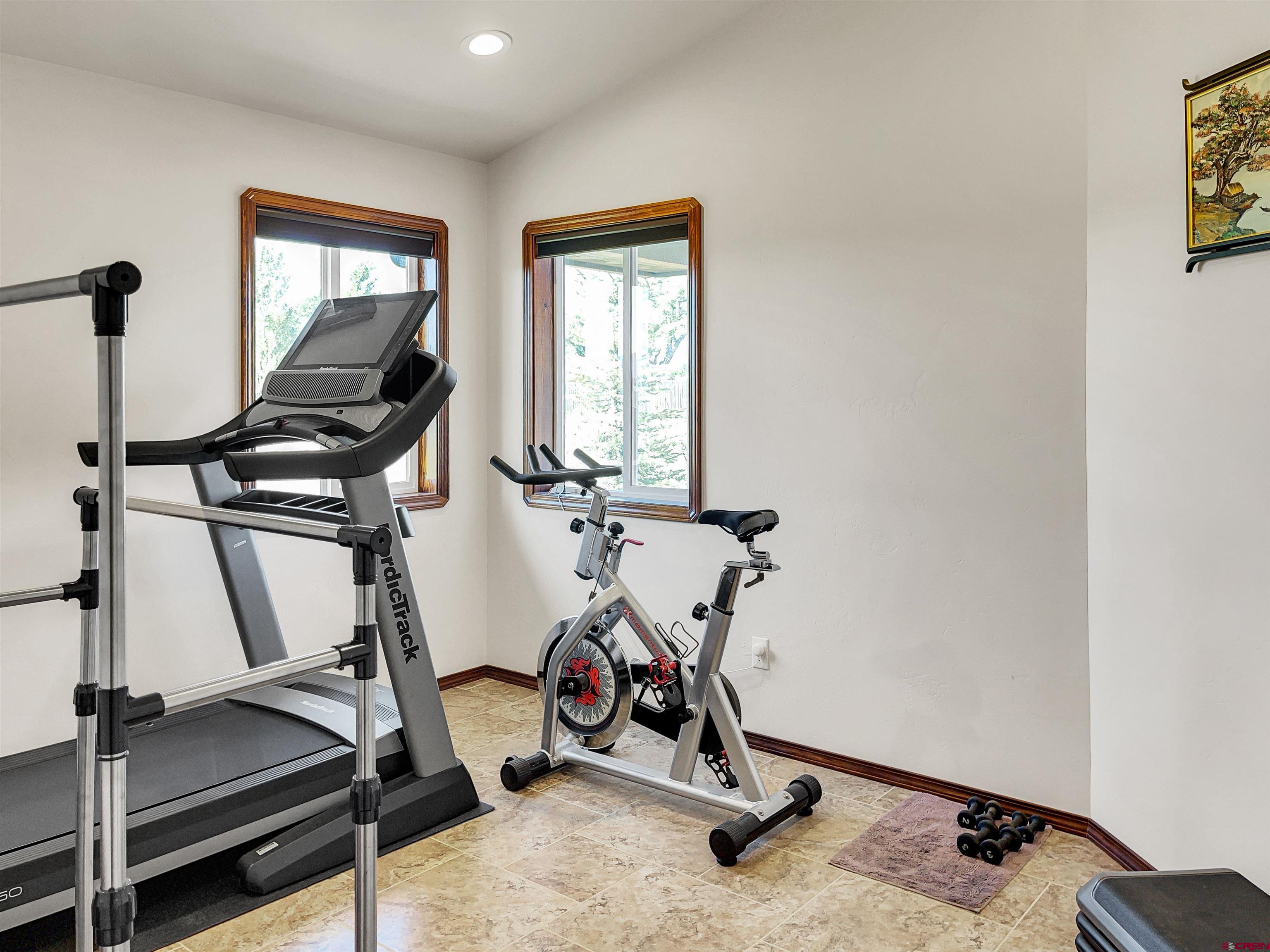 12336 Road 23.25 Loop Cortez, CO 81321 - Photo 9 of 34 a view of a room with gym equipment