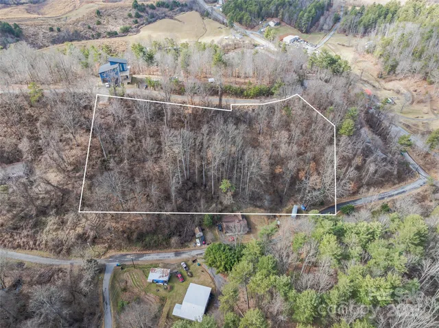 a small pool with some trees in the background