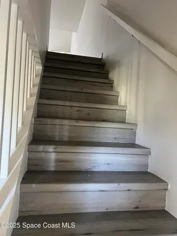 a view of walk in closet and window