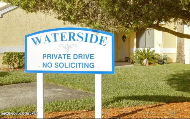 a view of a patio with table and chairs and potted plants