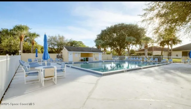 a view of a patio with swimming pool