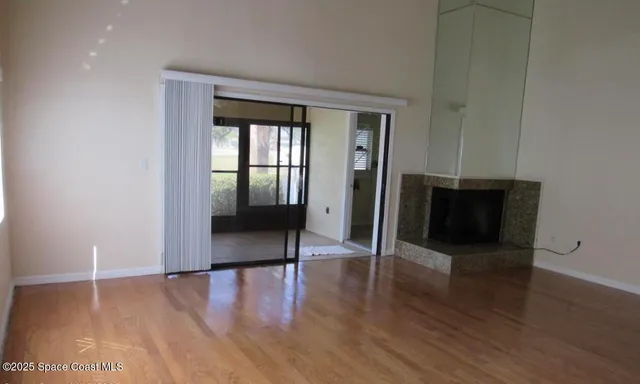 a view of a livingroom with wooden floor