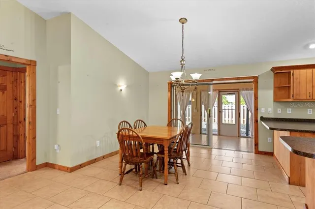 a view of a dining room with furniture and window