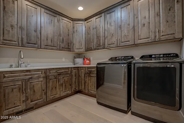 a kitchen with granite countertop cabinets stainless steel appliances and a sink