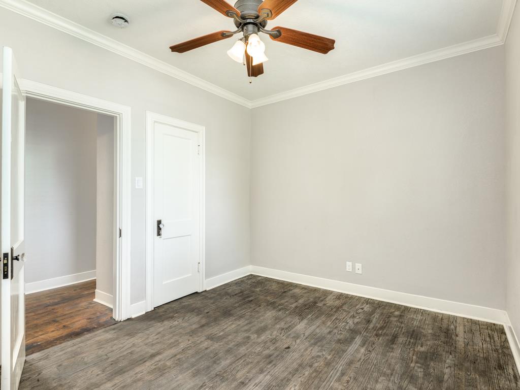 4528 Avenue R 1/2 Galveston, TX 77551 - Photo 17 of 22 an empty room with a ceiling fan and fan