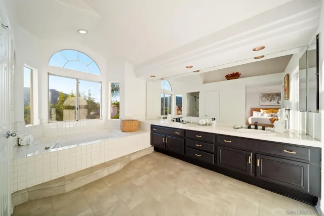 a white bath tub sitting next to a window