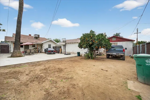 an aerial view of a house with a yard and a fountain