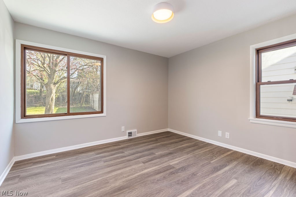 9620 David Road Garfield Heights, OH 44125 - Photo 20 of 36 Unfurnished room with hardwood / wood-style floors
