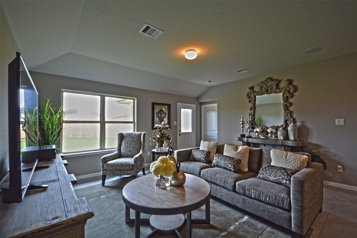 8515 Ideal Drive Rosharon, TX 77583 - Photo 8 of 28 a living room with furniture fireplace and a table