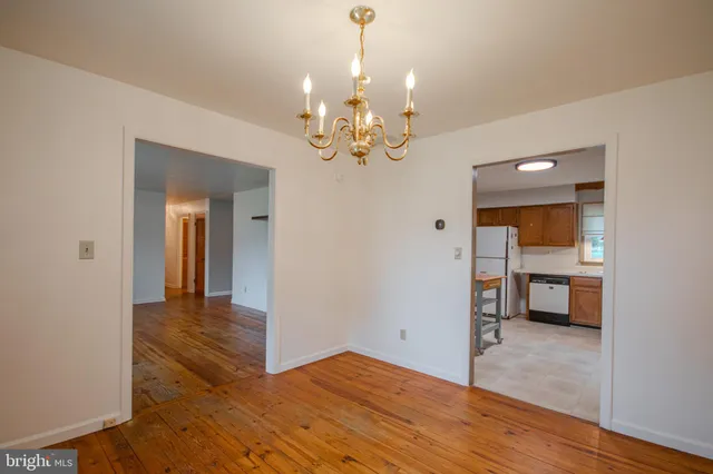 a view of an empty room with a bathroom