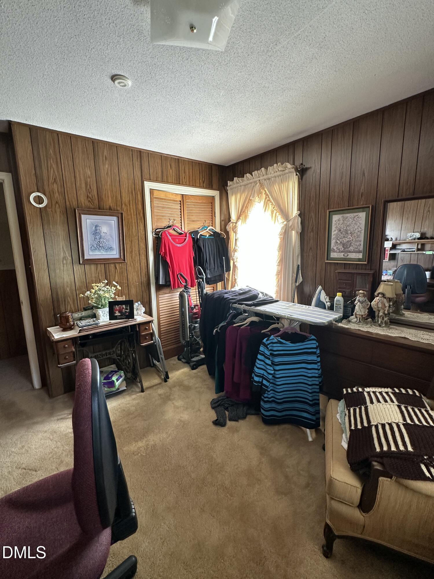 2516 Morphus Bridge Road Zebulon, NC 27597 - Photo 12 of 20 a bedroom with furniture and a large window