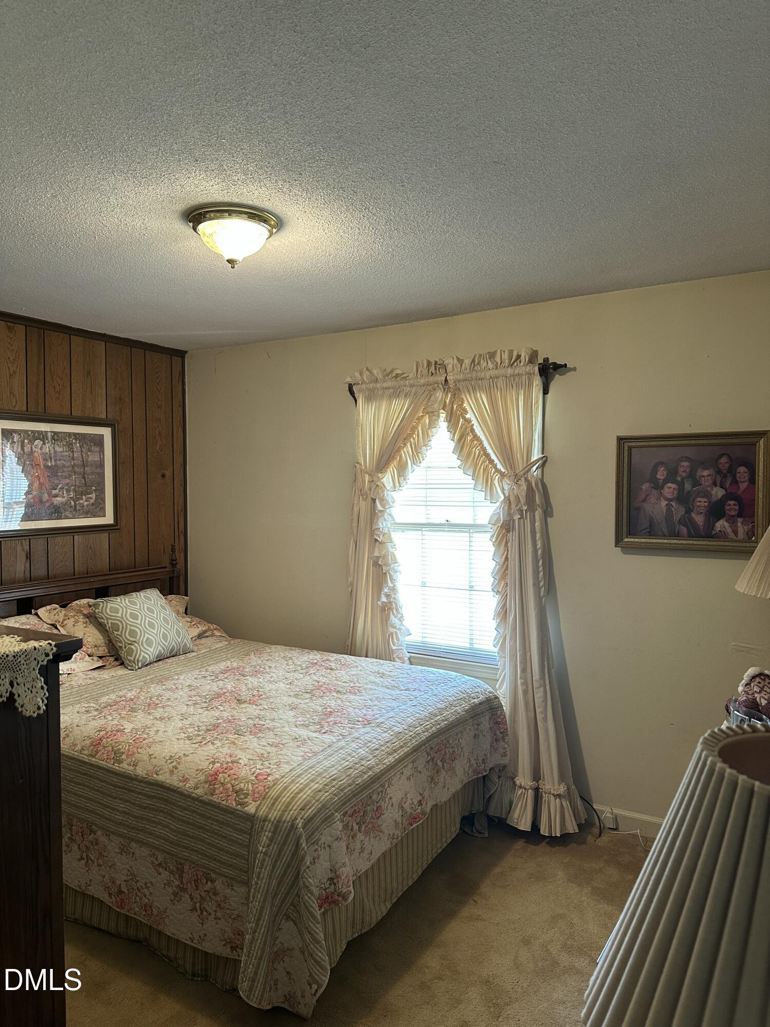 2516 Morphus Bridge Road Zebulon, NC 27597 - Photo 8 of 20 a bedroom with a bed and a window