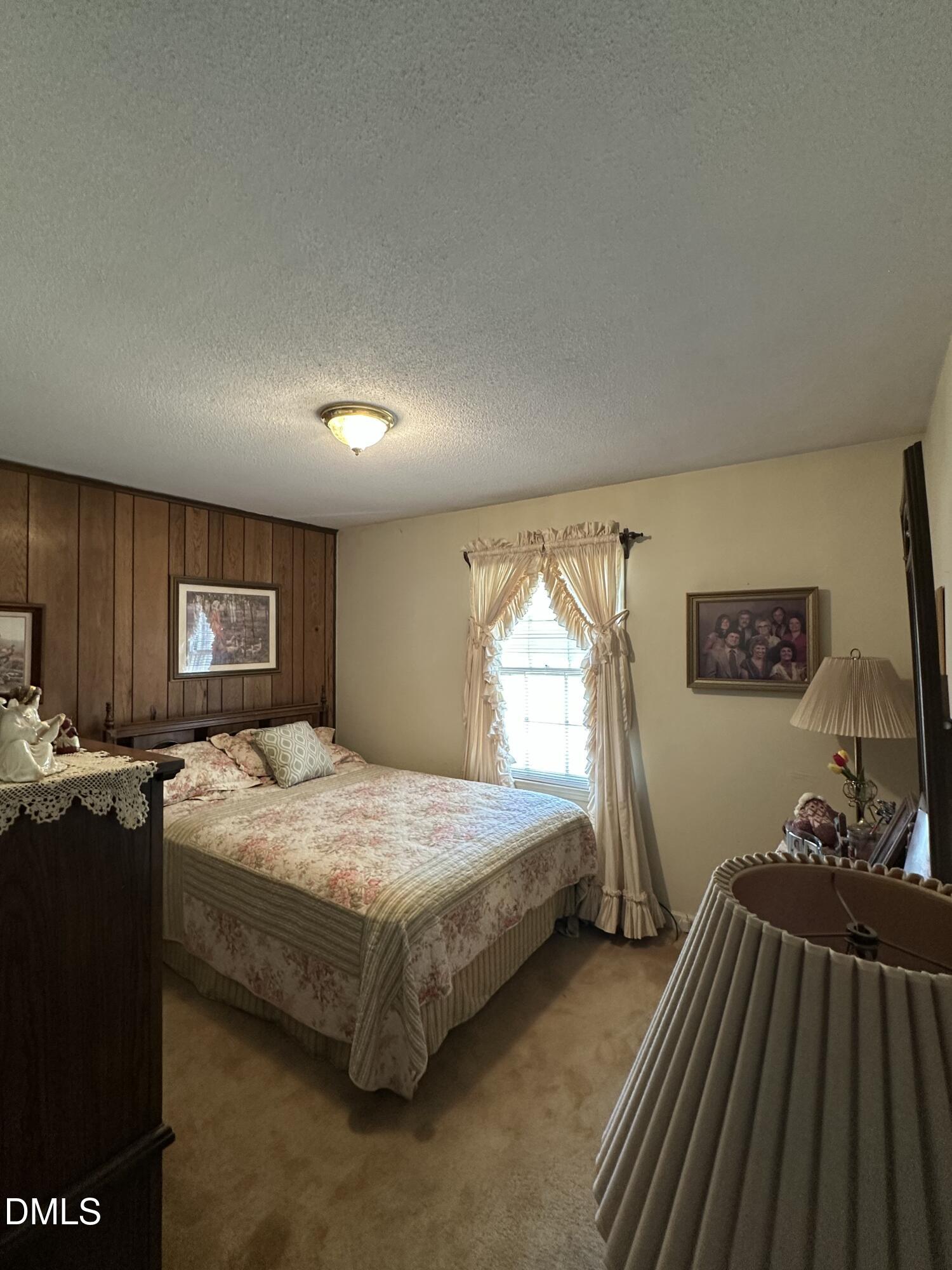 2516 Morphus Bridge Road Zebulon, NC 27597 - Photo 10 of 20 a bedroom with bed and window