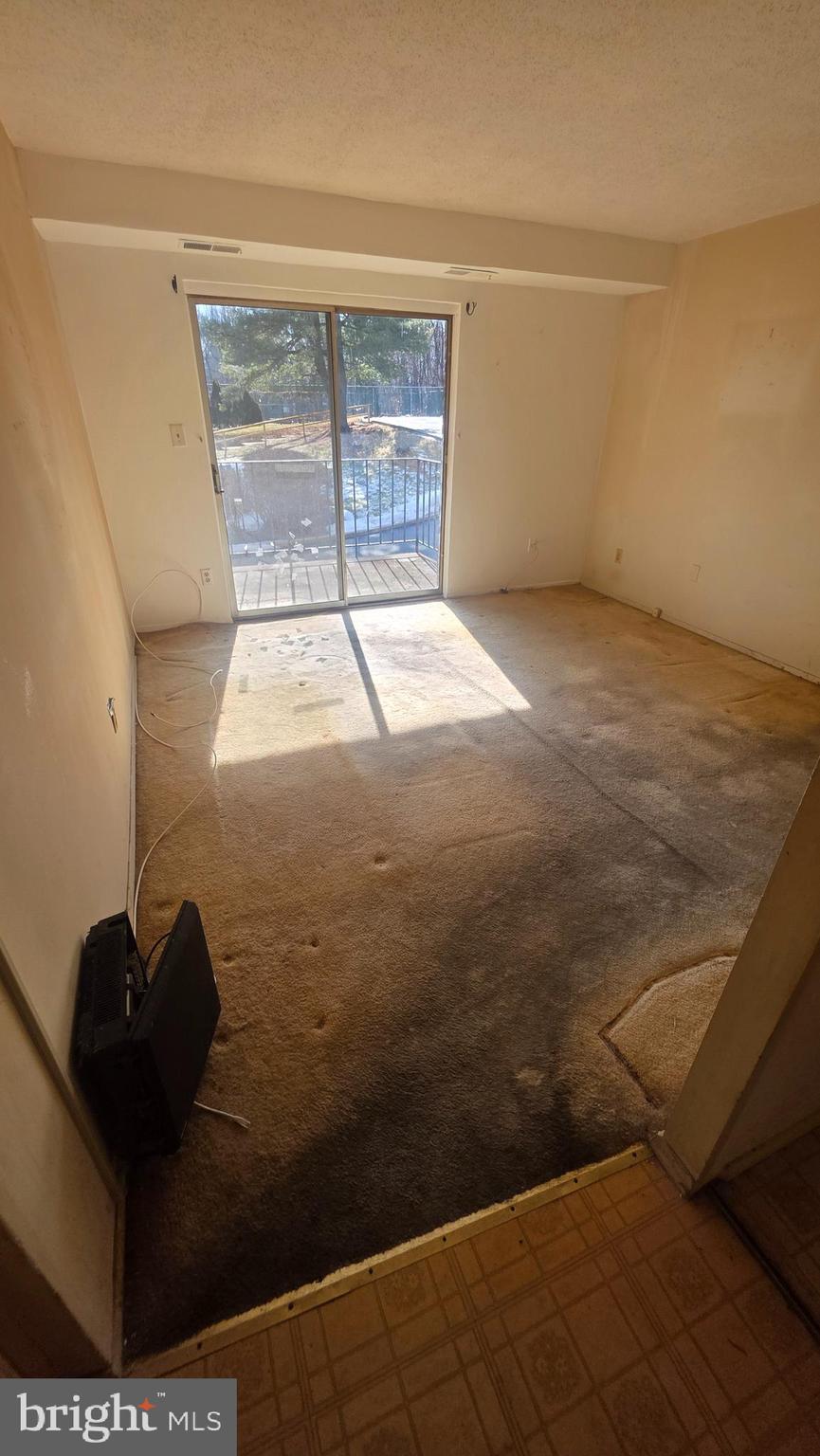 11908 Tarragon Road, Unit G Reisterstown, MD 21136 - Photo 13 of 45 a view of empty room