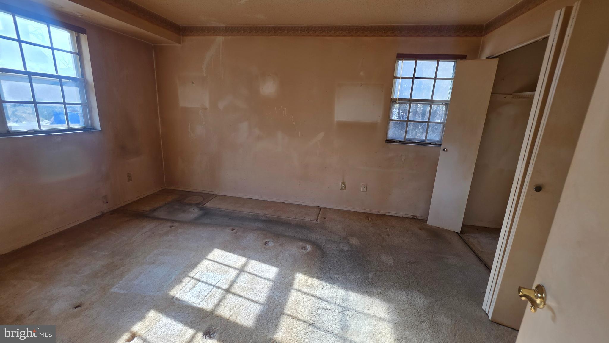 11908 Tarragon Road, Unit G Reisterstown, MD 21136 - Photo 26 of 45 an empty room with windows
