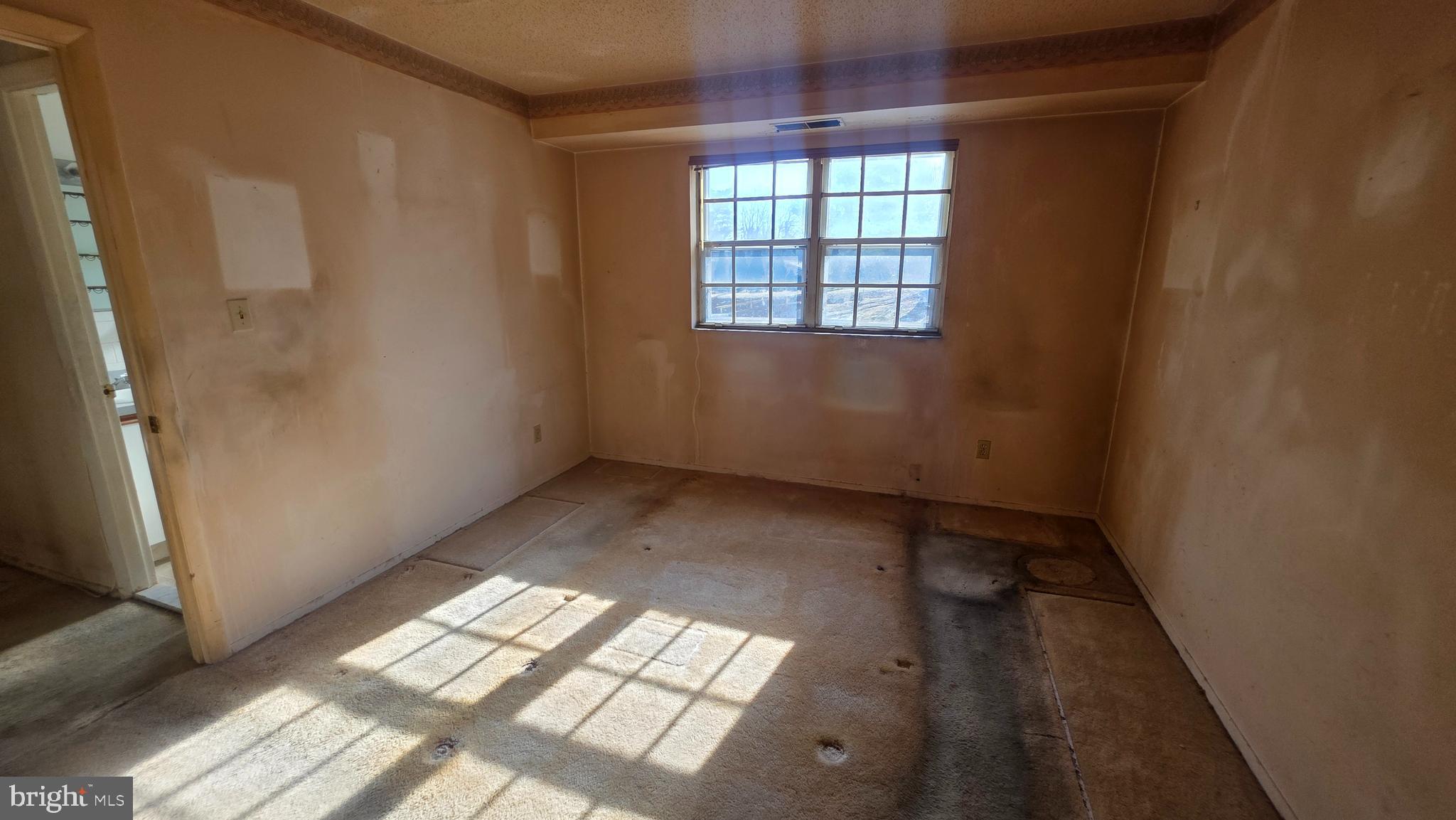 11908 Tarragon Road, Unit G Reisterstown, MD 21136 - Photo 27 of 45 an empty room with windows