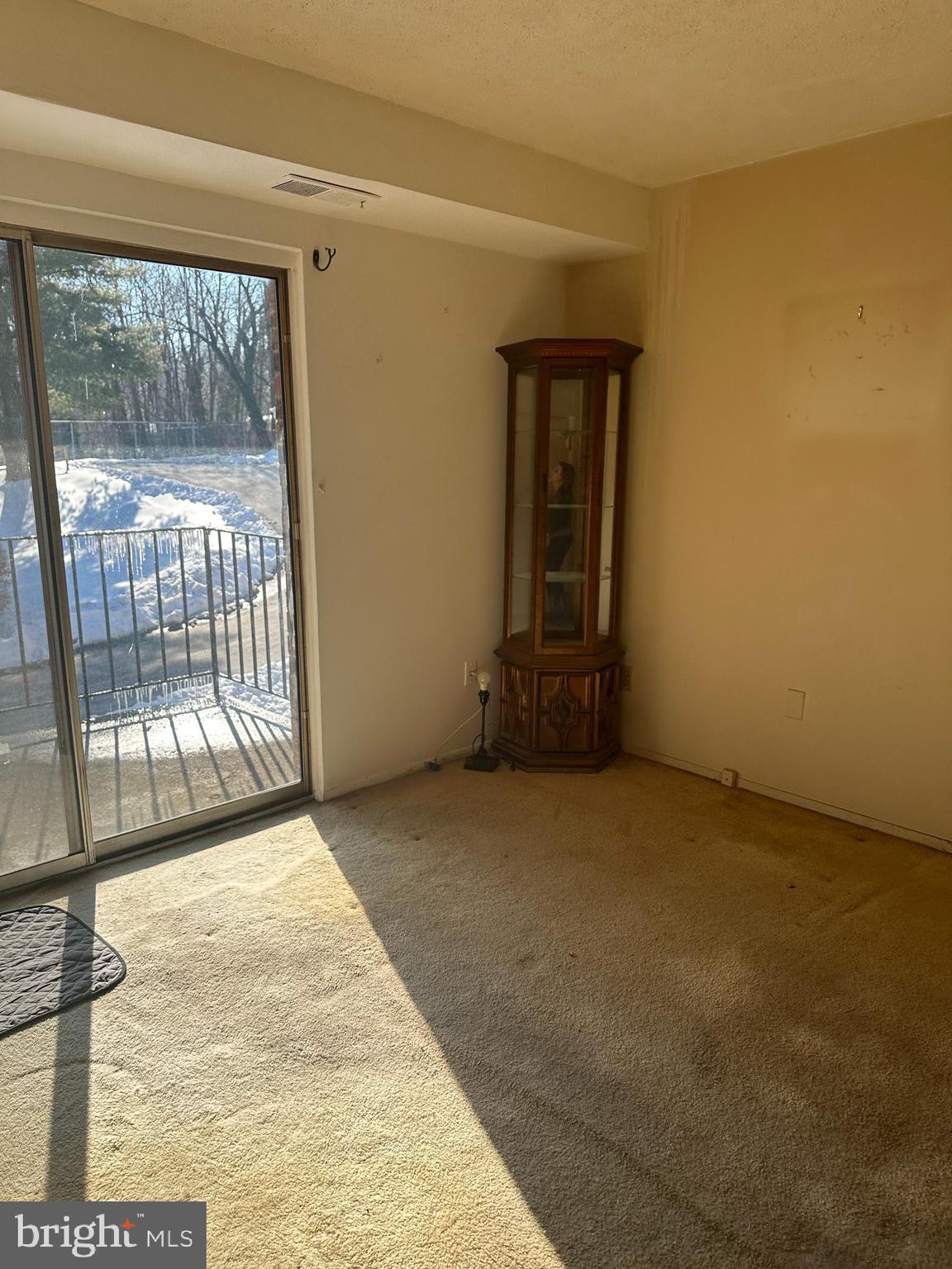 11908 Tarragon Road, Unit G Reisterstown, MD 21136 - Photo 3 of 45 a view of an empty room with glass door