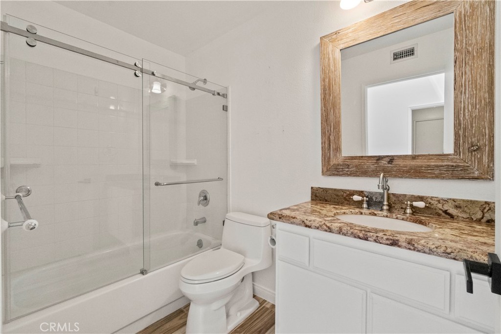 3367 Lathrop Avenue Simi Valley, CA 93063 - Photo 18 of 36 a bathroom with a granite countertop sink toilet and shower